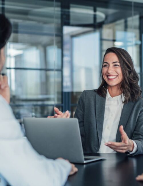 Shot of group of business persons in business meeting. Three entrepreneurs on meeting in board room. Corporate business team on meeting in modern office. Female manager discussing new project with her colleagues. Company owner on a meeting with two of her employees in her office.